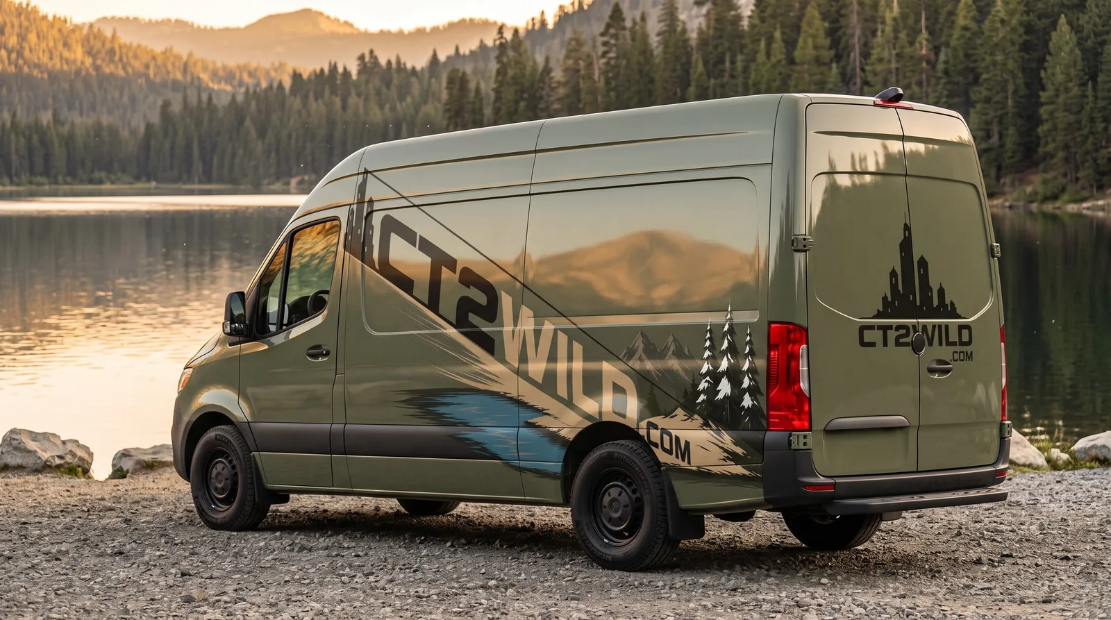 Golden hour on a lake shore: the rear doors carry the skyline and the name.